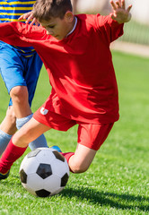 Kids soccer football - children players match on soccer field © Dusan Kostic