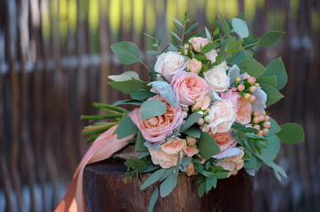 Pink and white roses bunch on stump