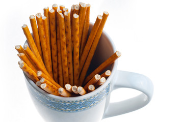 bread sticks isolated in a cup