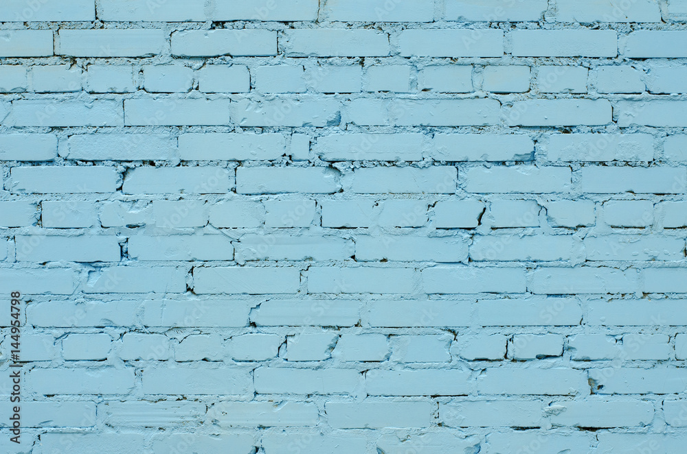 Wall mural Texture of an old light blue brick wall.