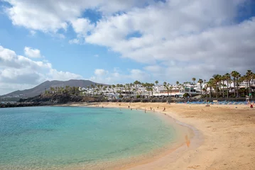 Poster Flamingo beach in the town of Playa Blanca, in Lanzarote, Canary Islands, Spain © Delphotostock