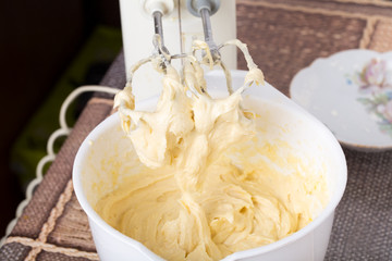 Mixing dough with flour.