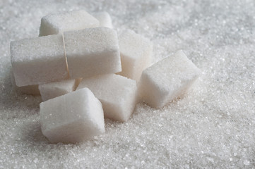sugar background surface with cubes. Closeup view