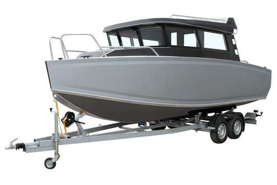 Modern cabin boat on the trailer for transportation.