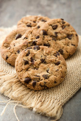 Chocolate chip cookies on wooden table background
