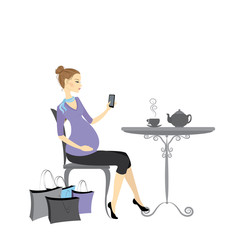 Beautiful fashion pregnant woman with a cell phone in her hand, sits in a cafe at a table