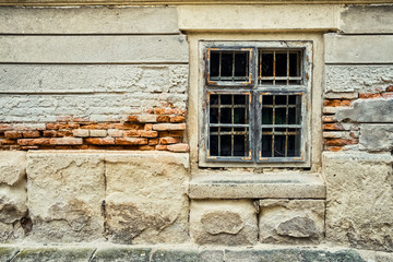 Fototapeta na wymiar Old building damaged facade window