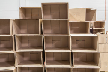 Opened empty brown cardboard boxes in storehouse