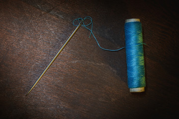 Still life- spool, thread, needle
