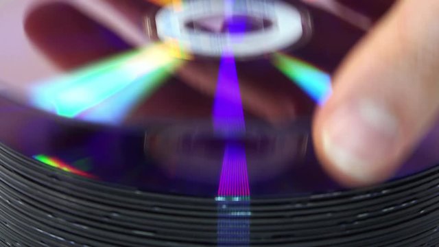 Close-up View of Woman take a CD. 4K