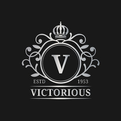 Vector monogram logo template. Luxury letter design. Graceful vintage character with crown and lions illustration.