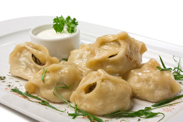dish of ravioli with sour cream