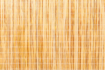 Brown bamboo straw mat.
