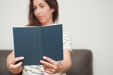 young woman reading a book