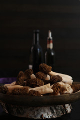 Raw morels on the dark background