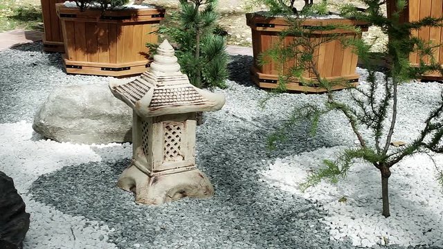 Landscape design. Decoration for the garden. The stone figure in the shape of a Chinese house. HD