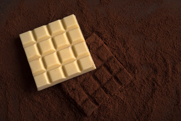 Top view of milk and white homemade chocolate bars