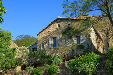 Fototapeta na wymiar Garden and an old maison (house) in the the Ardeche, France, during spring.