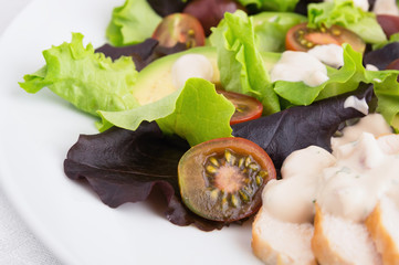 salad with fresh vegetables and chicken breast