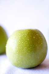 Green apple close up on a white background 