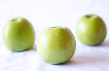 Green apple close up on a white background 