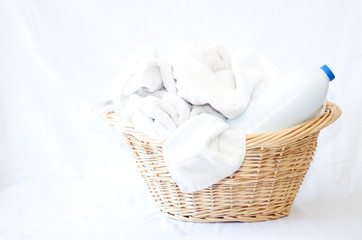 Laundry basket with white linen