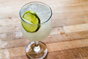 Daiquiri cocktail with lime and crushed ice.