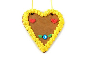 Oktoberfest gingerbread heart cookie with copy space on white isolated background