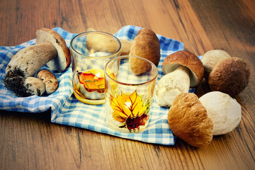 Basket with fresh penny bun  mushrooms on table