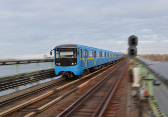 Fototapeta premium Metro train in motion. Kyiv. Ukraine. Metro railway connecting districts located on right and left banks of Dnieper River.