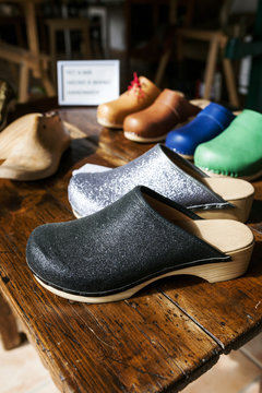 Assortment of clogs on table