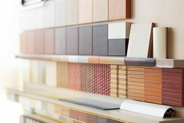 Furniture fittings multicolored chipboard panels close-up background laminated chipboards color palette texture furniture sample parquet boards in hardware store in home improvement warehouse exterior