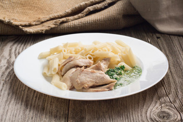Pasta penne with chicken and homemade parsley sauce