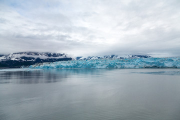 Naklejka na ściany i meble Blue Glacier Ice in Misty Waters
