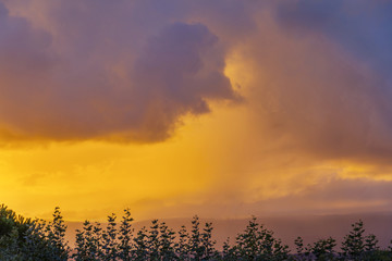 Fototapeta premium Stormy clouds at sunset