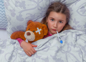 child ill in bed
