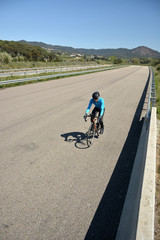 Fototapeta na wymiar cyclist training on a lonely road