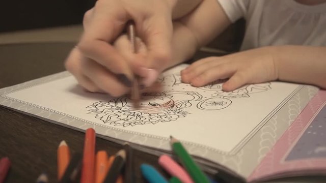 Mother and daughter coloring leaf