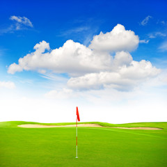 Green golf field blue sky background