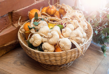 Onions garlic, fresh herbs in basket