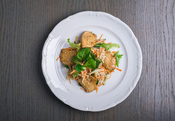 Oriental salad with carrots, greens and sesame seeds