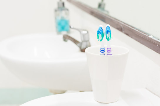 Toothbrush in toilet and selective focus.