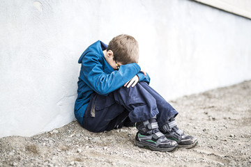 Elementary school pupil outside with rucksack