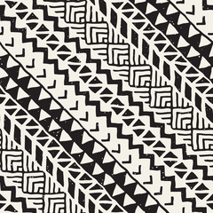 Black and white tribal vector seamless pattern with doodle elements. Aztec abstract art print. Ethnic ornamental hand drawn backdrop.