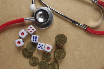 Red stethescope on wooden background. Medical and health care concept.