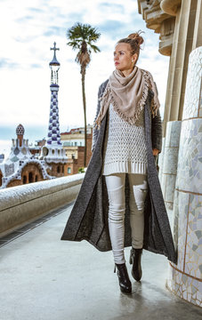 trendy woman in Barcelona, Spain in winter walking