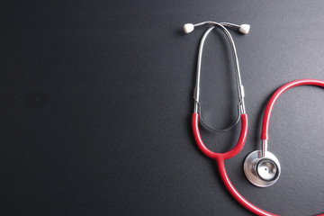 Red stethoscope,keyboard ,puzzle and coins. Medical concept.