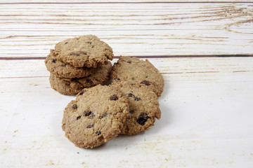 Chocolate chip cookies on old wooden table