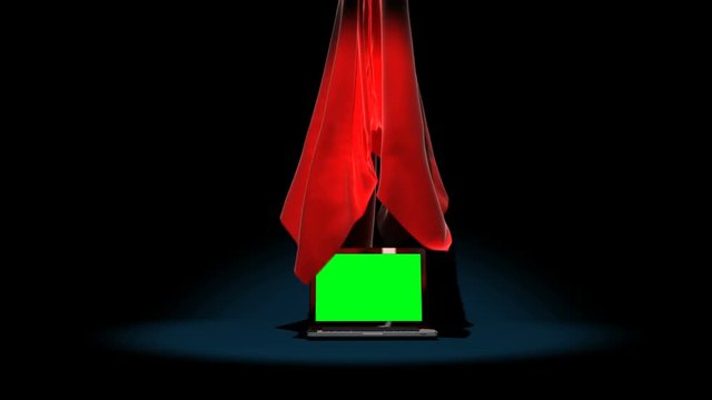 4k Red satin cloth is lifted to reveal a laptop with a green screen.