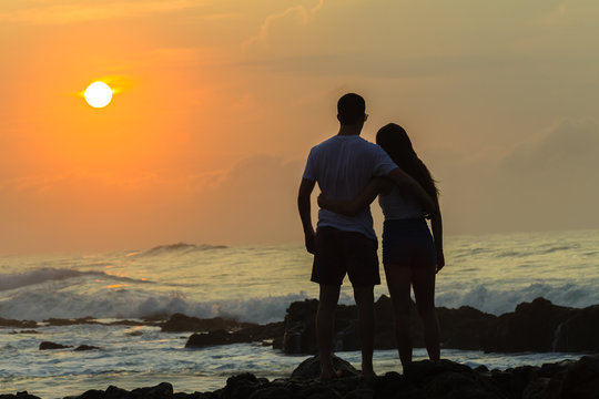 Girl Boy Beach Ocean Silhouetted Sunrise Landscape